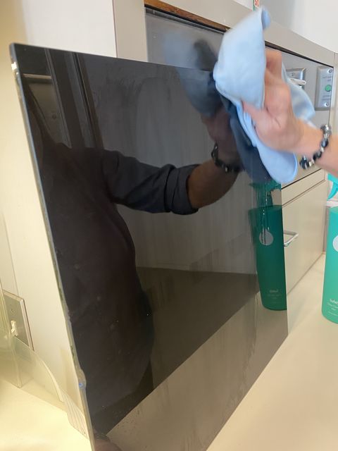 cleaning a glass surface at the good housekeeping institute