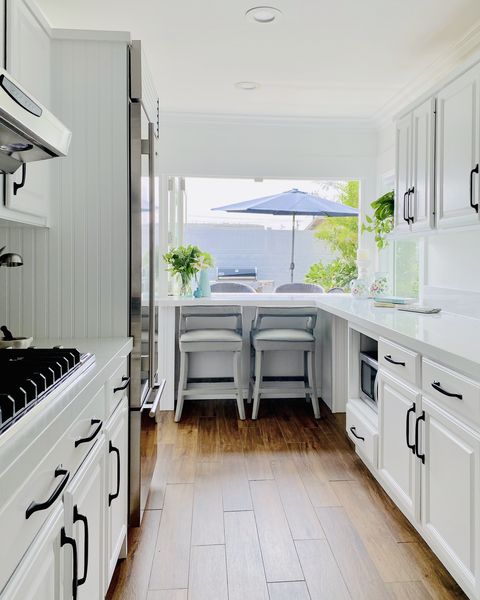 galley kitchen idea white cabinets black hardware
