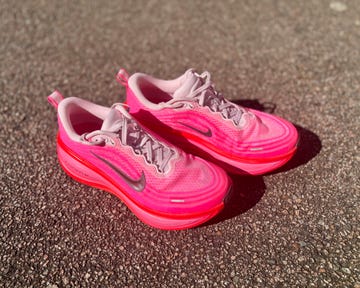 a pair of running shoes on a pavement
