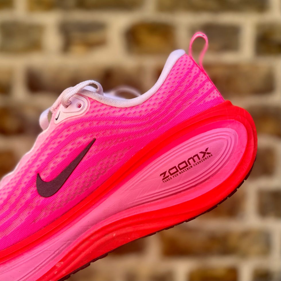 the heel of a running shoe against the backdrop of a brick wall