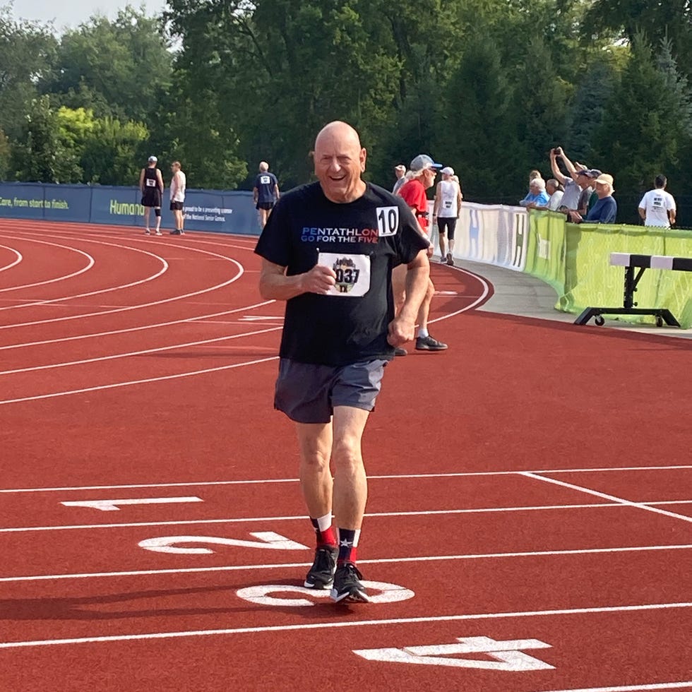 a runner on a red running track