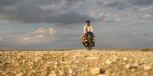 Noel riding his bike during his epic cross country journey