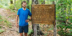 joe mcconaughy stands next to the long trail sign after capturing the unsupported fkt on june 15