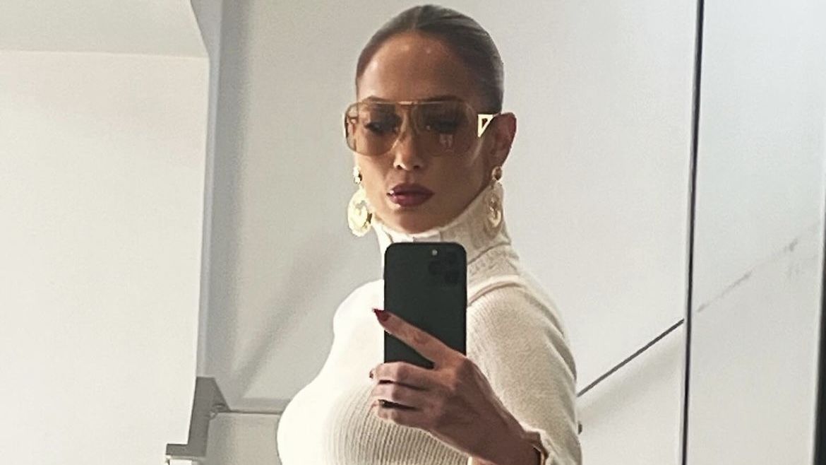 Jennifer Lopez Elevates Her White Knit Sweater with Glamorous Gold Jewelry