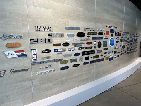 wall of logos and badges at airstream heritage center