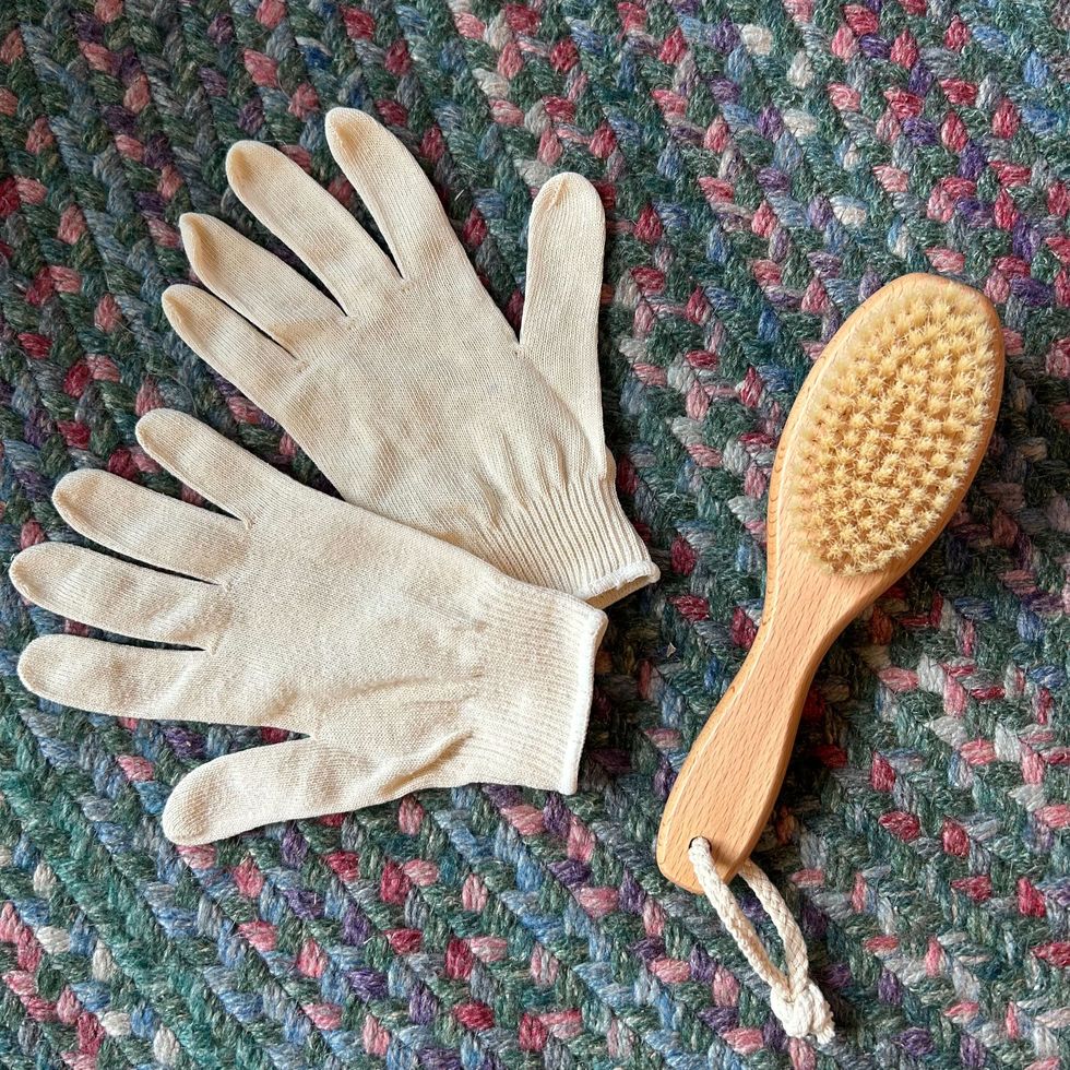 a pair of gloves and a spoon
