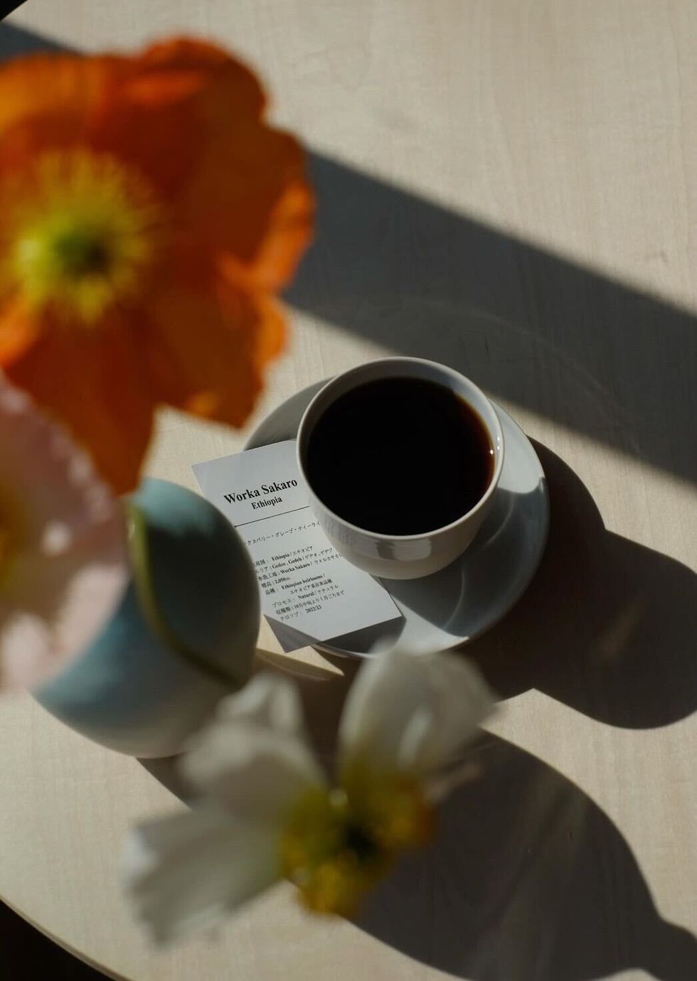 a cup of coffee and a flower