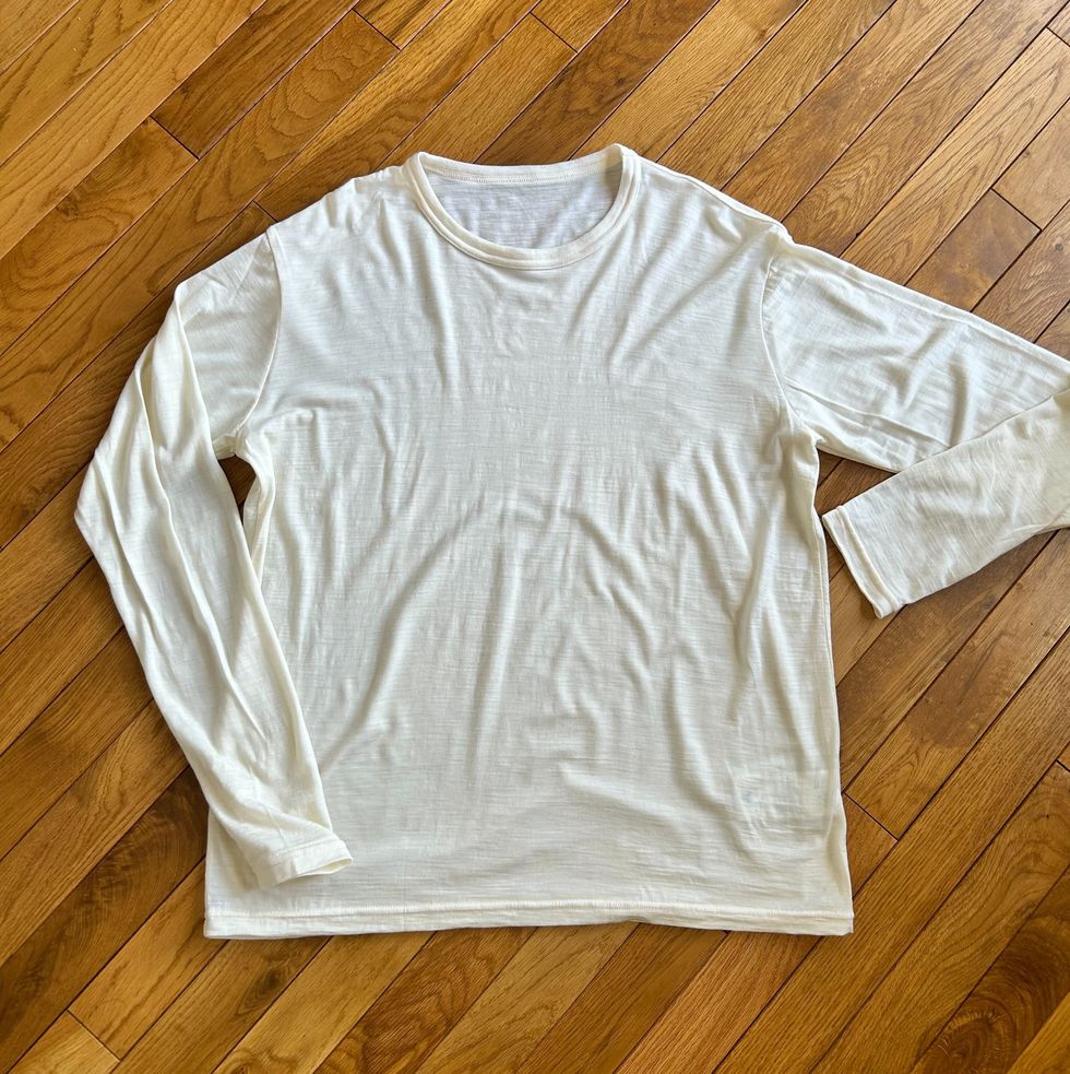 a white shirt on a wooden surface