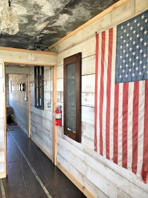 Flag of the united states, Property, Flag, Wall, Building, Room, House, Home, Architecture, Wood, 