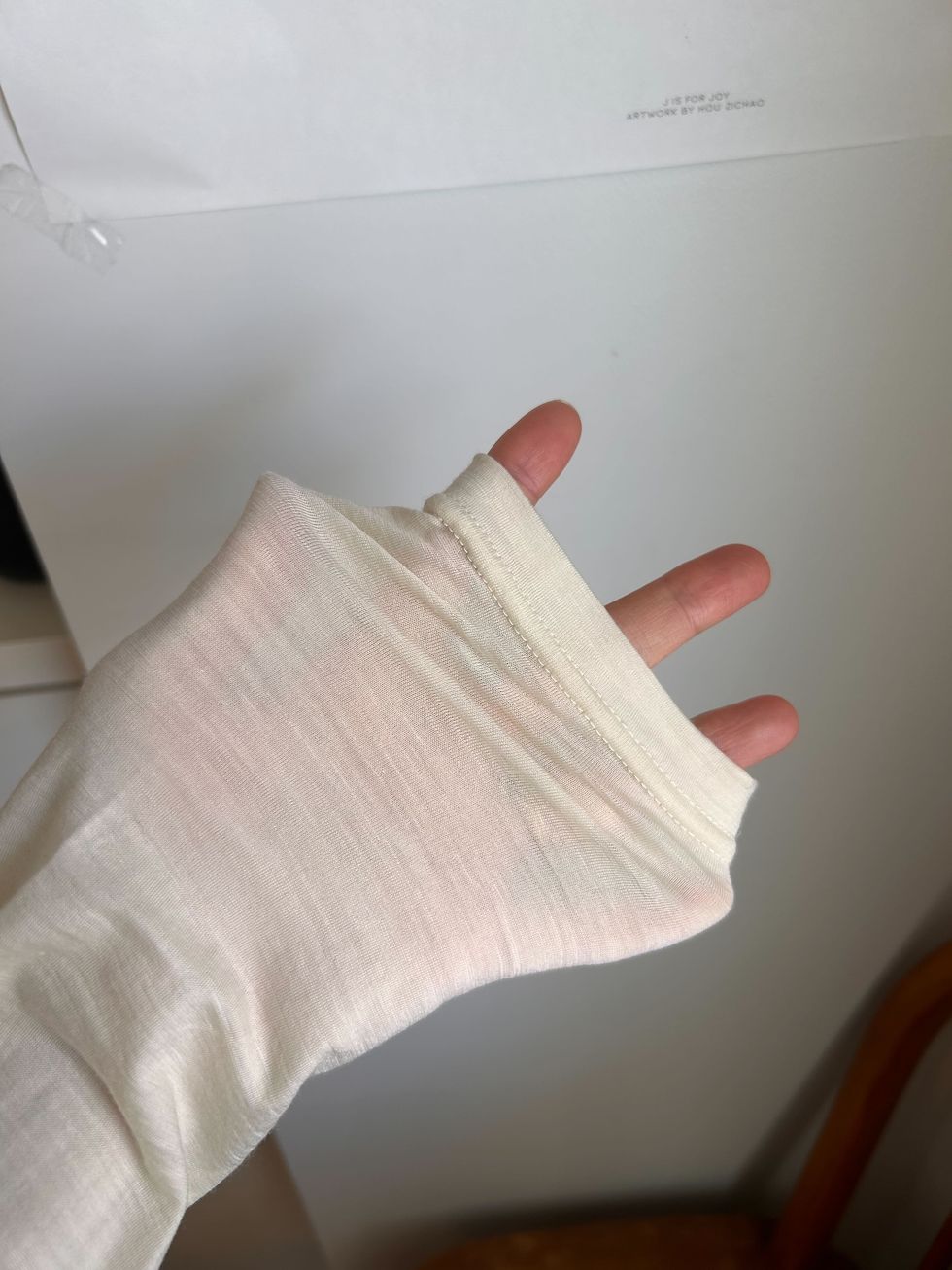a hand with a white towel