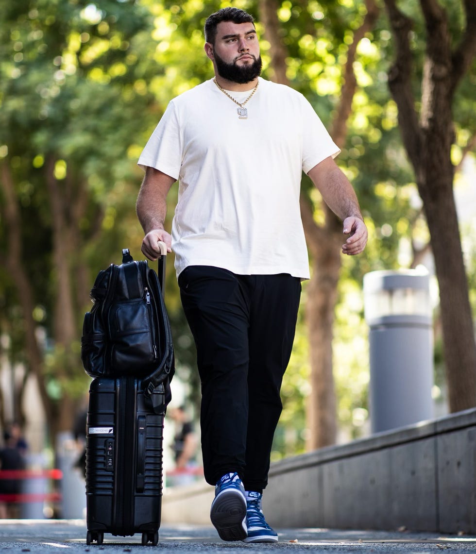 a man walking with a backpack