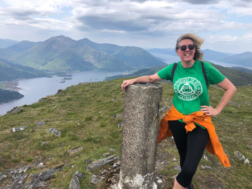 a woman posing on a rock