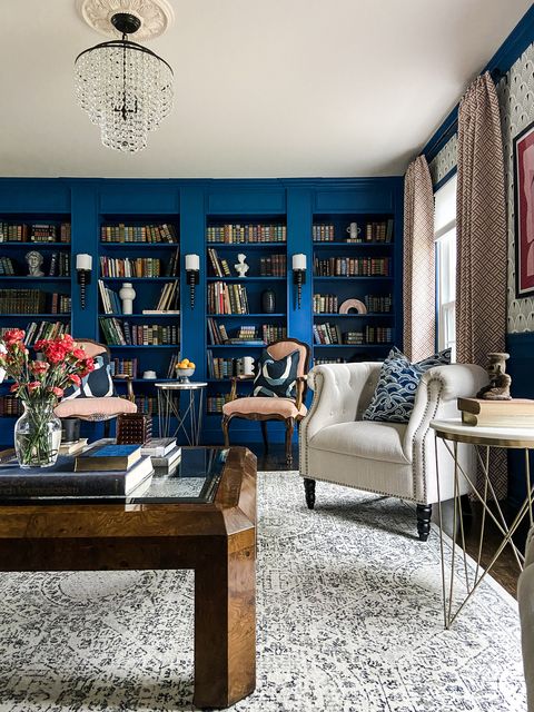 blue library, sitting room, red reading chairs, white sitting chair, wooden coffee table