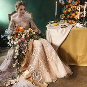 Yellow, Petal, Textile, Tablecloth, Bridal clothing, Dress, Bouquet, Gown, Wedding dress, Cut flowers, 