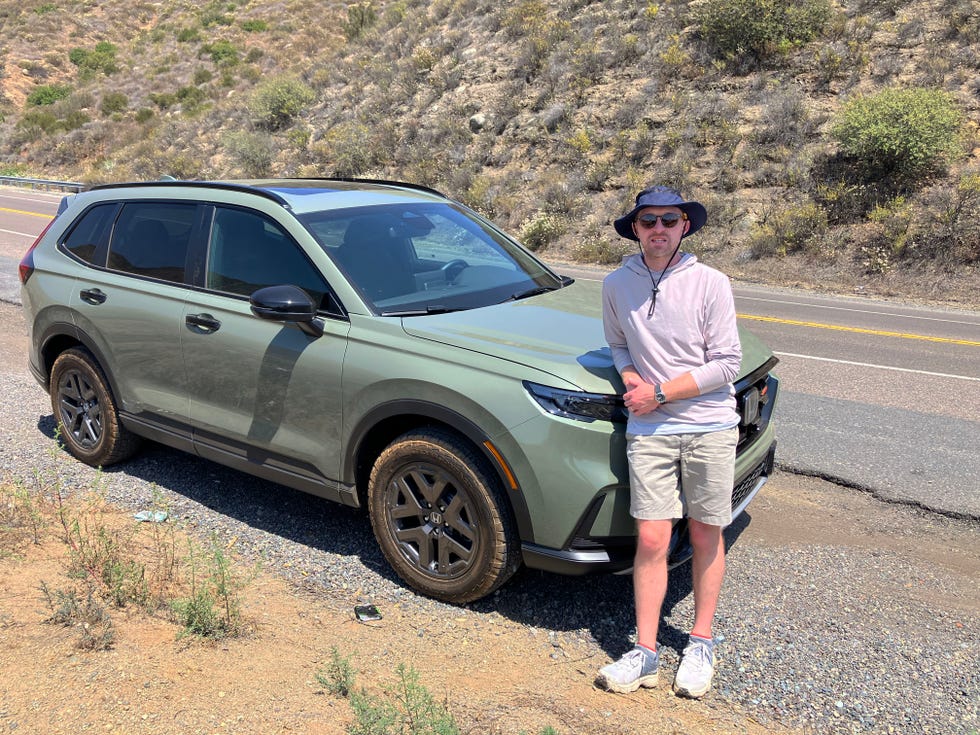 a writer posed with a cr v