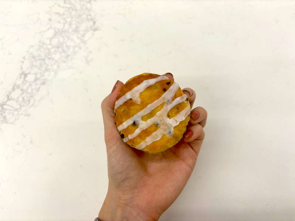 a hand holding a cookie