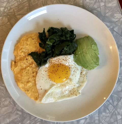 cheesy egg "grits" with greens and avocado