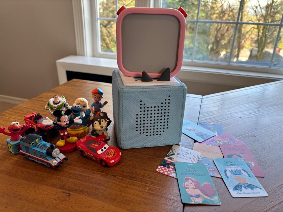 a colorful speaker with toys and childrens storybooks