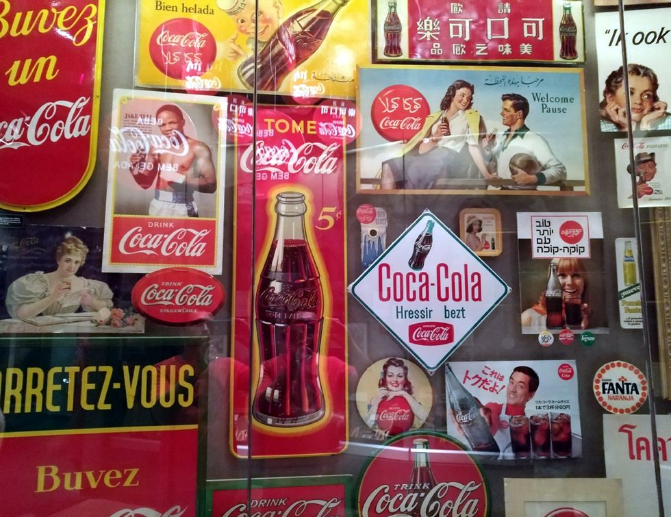 Coca-cola, Cola, Coca, Drink, Carbonated soft drinks, Advertising, Plant, Soft drink, Vending machine, Display advertising, 