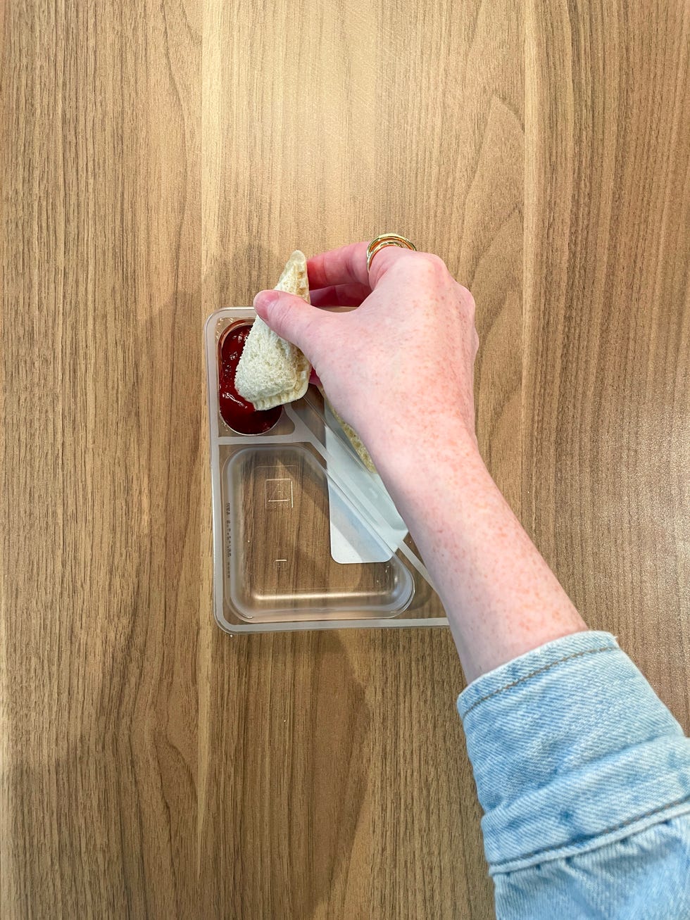 dipping lunchables peanut butter sandwich into jam