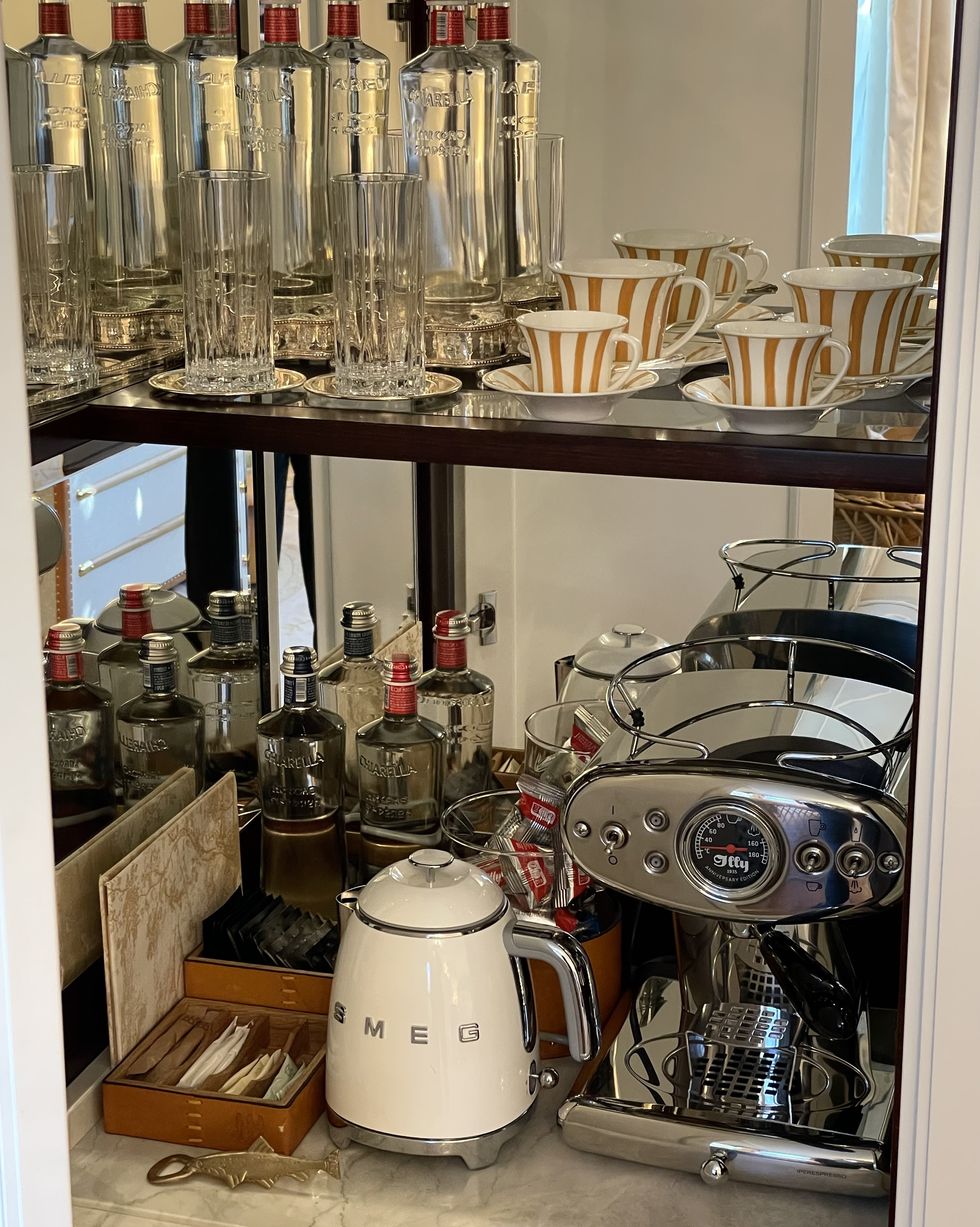 a kitchen with a coffee maker and other objects