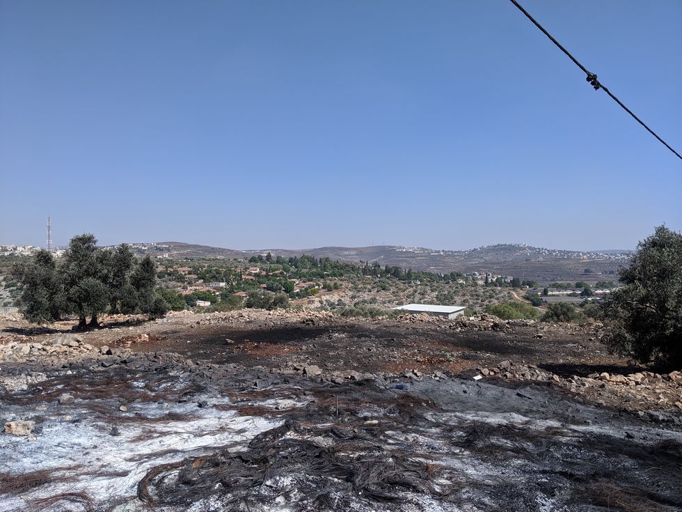 the remains of burnt out tyres at a protest site in ﻿kfar qaddum, west bank