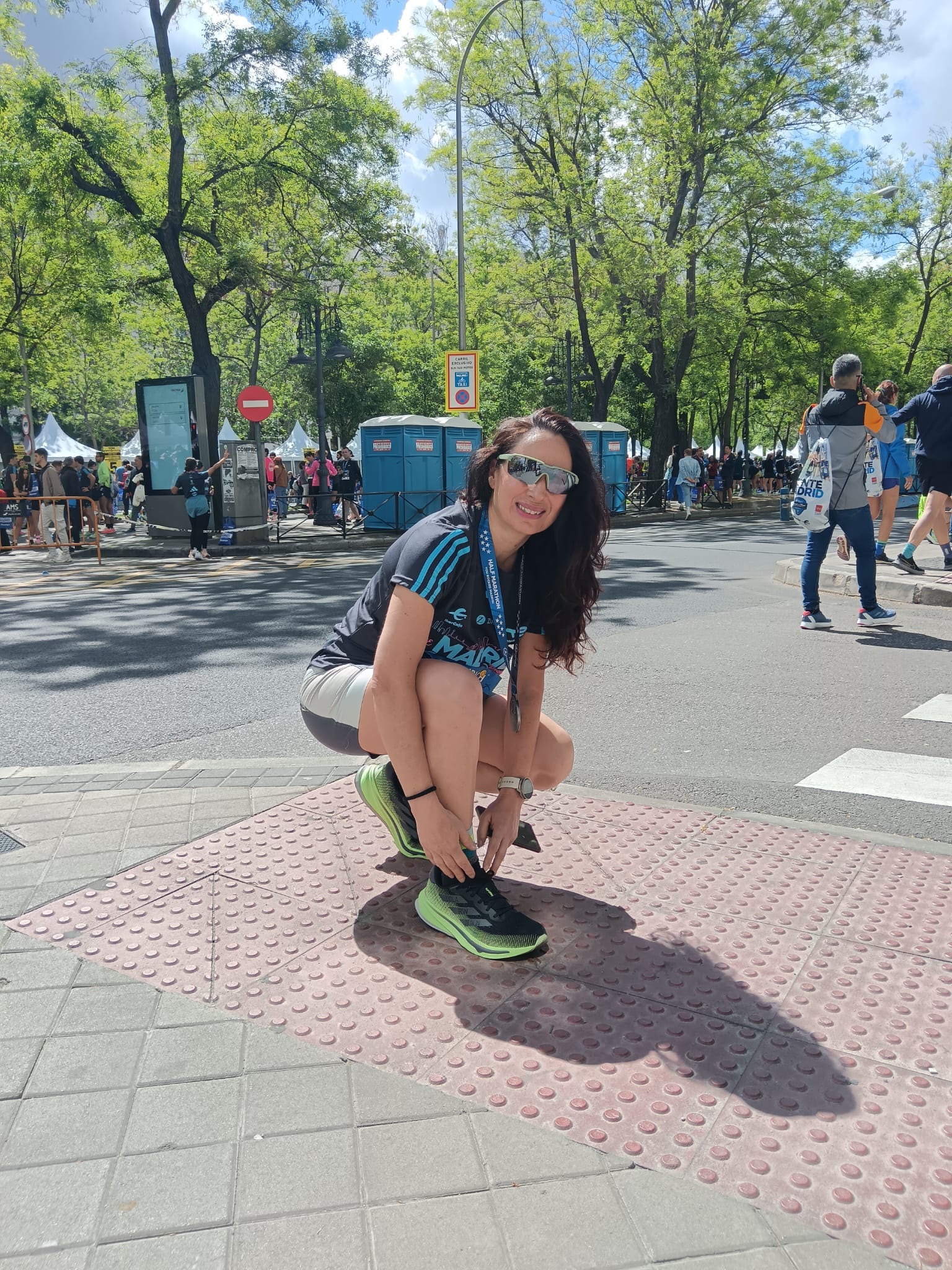 a person sitting on a sidewalk