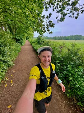 a man standing on a dirt path