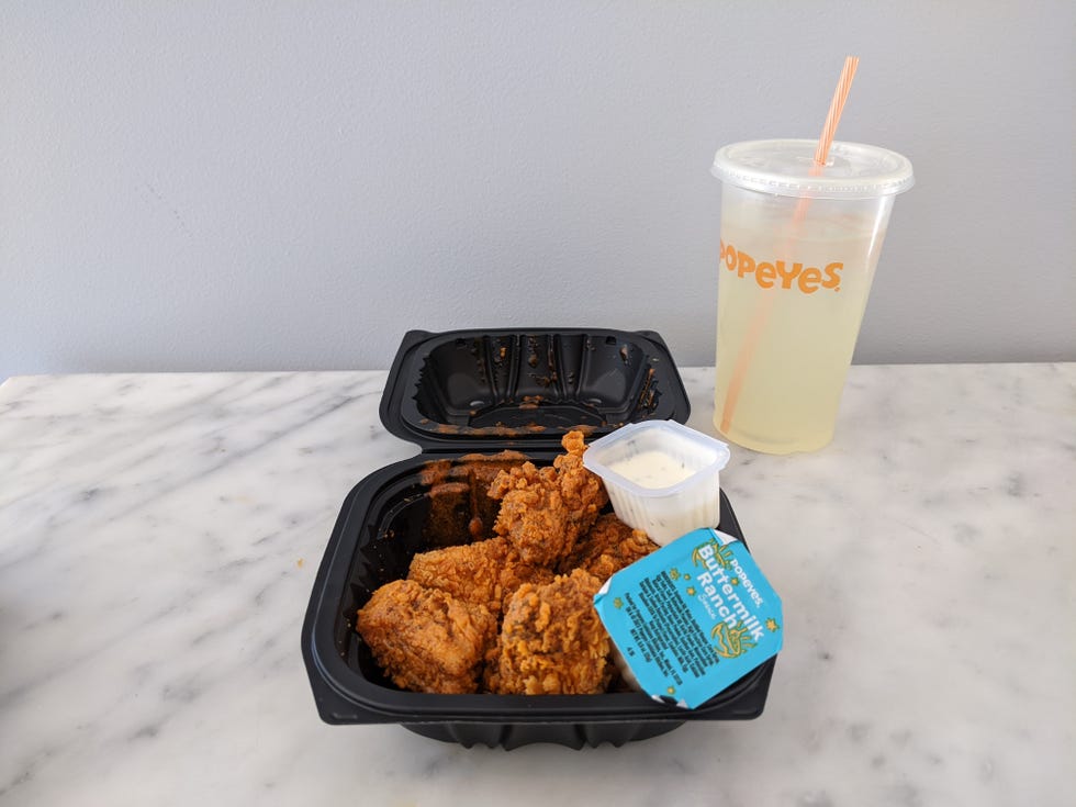 popeyes pickle menu boneless chicken wings with pickle lemonade in background