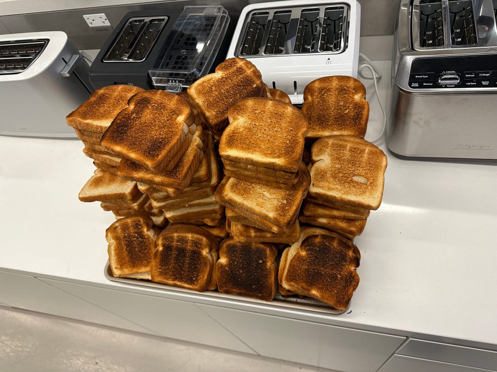 a pile of toast in front of the toasters