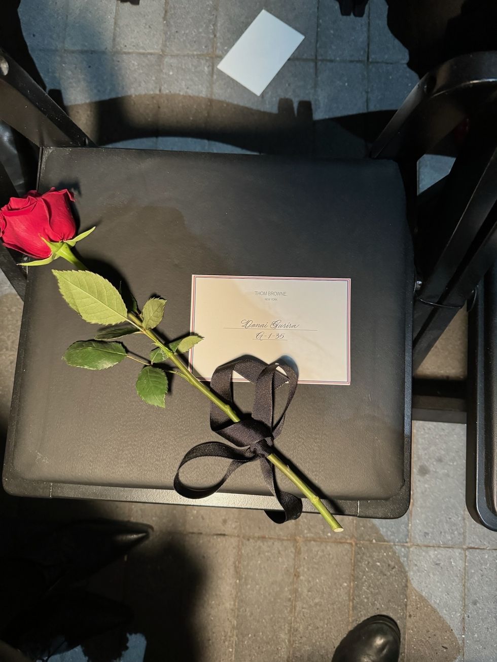 a rose and a note on a table