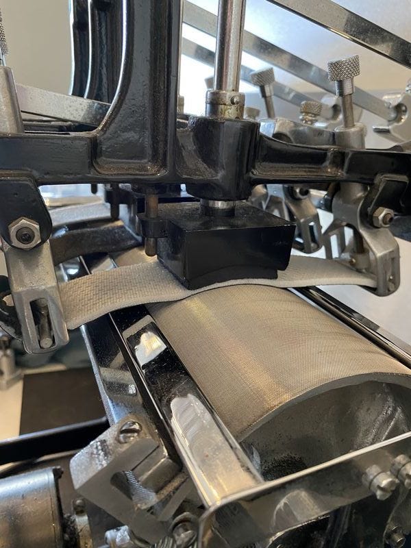 swatches of car seat covers in the abrasion machine