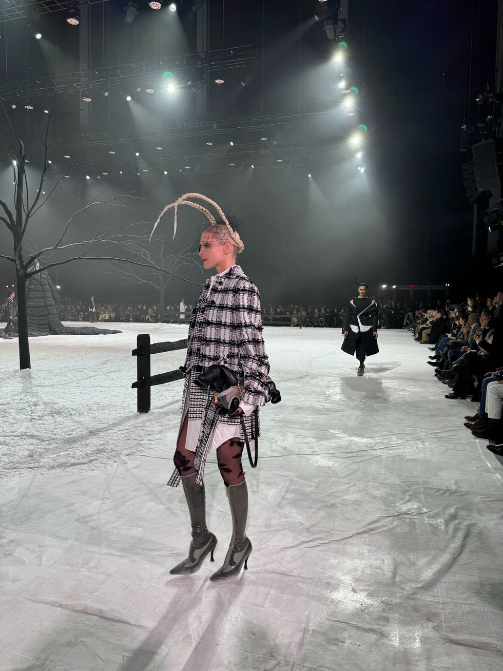 a person wearing a plaid dress and ice skates
