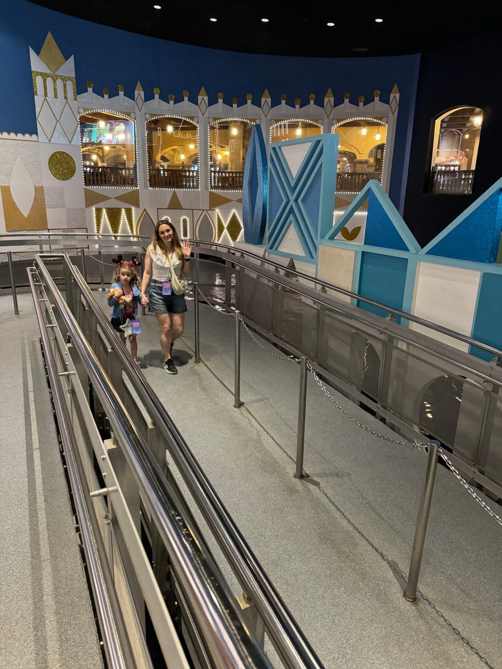 waiting area for an attraction featuring decorative panels and barriers