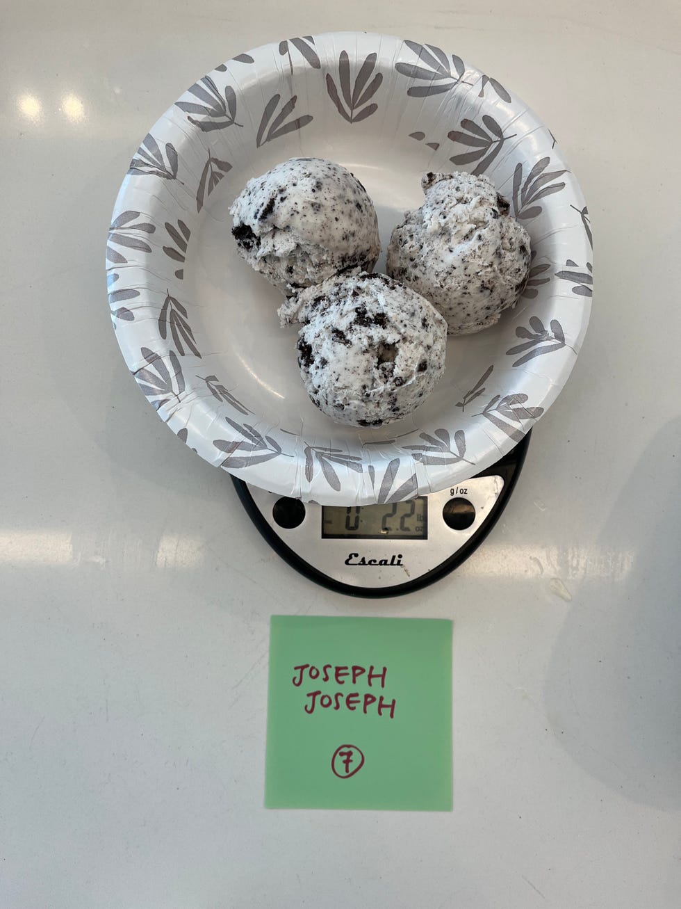 bowl with three scoops of ice cream on a scale