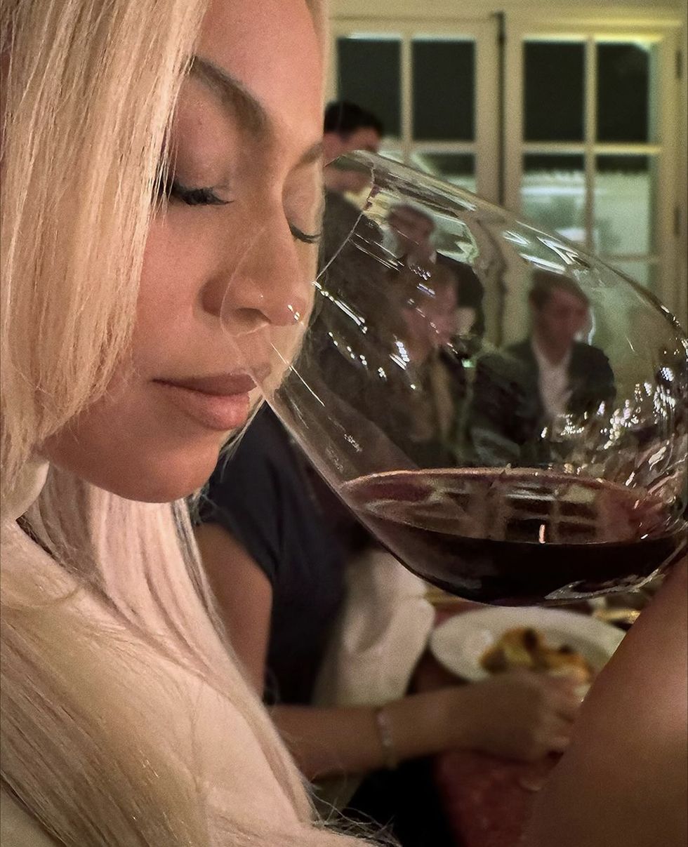 a person drinking wine