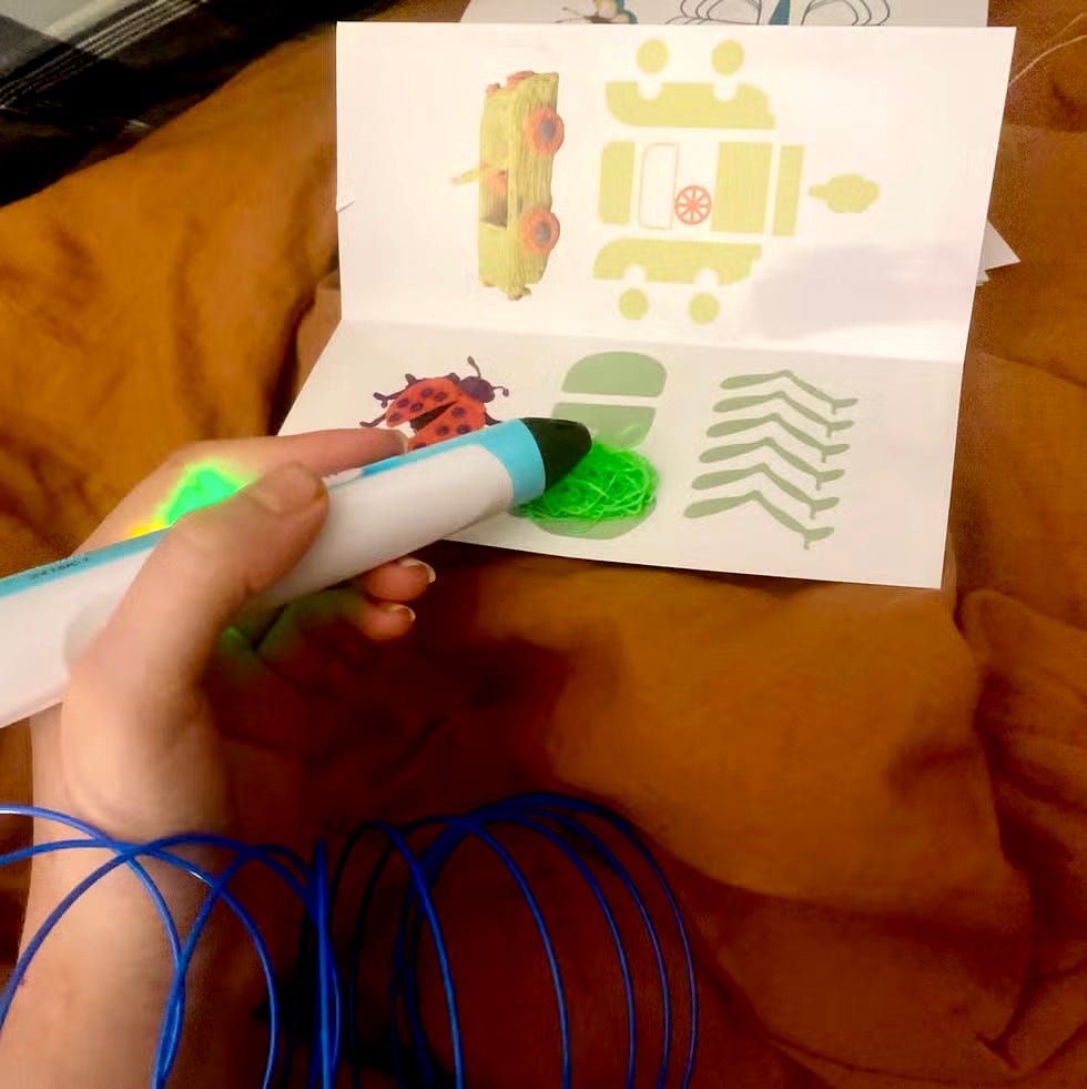 a home tester tests the scrib3d 3d pen for the good housekeeping institute, using a stencil