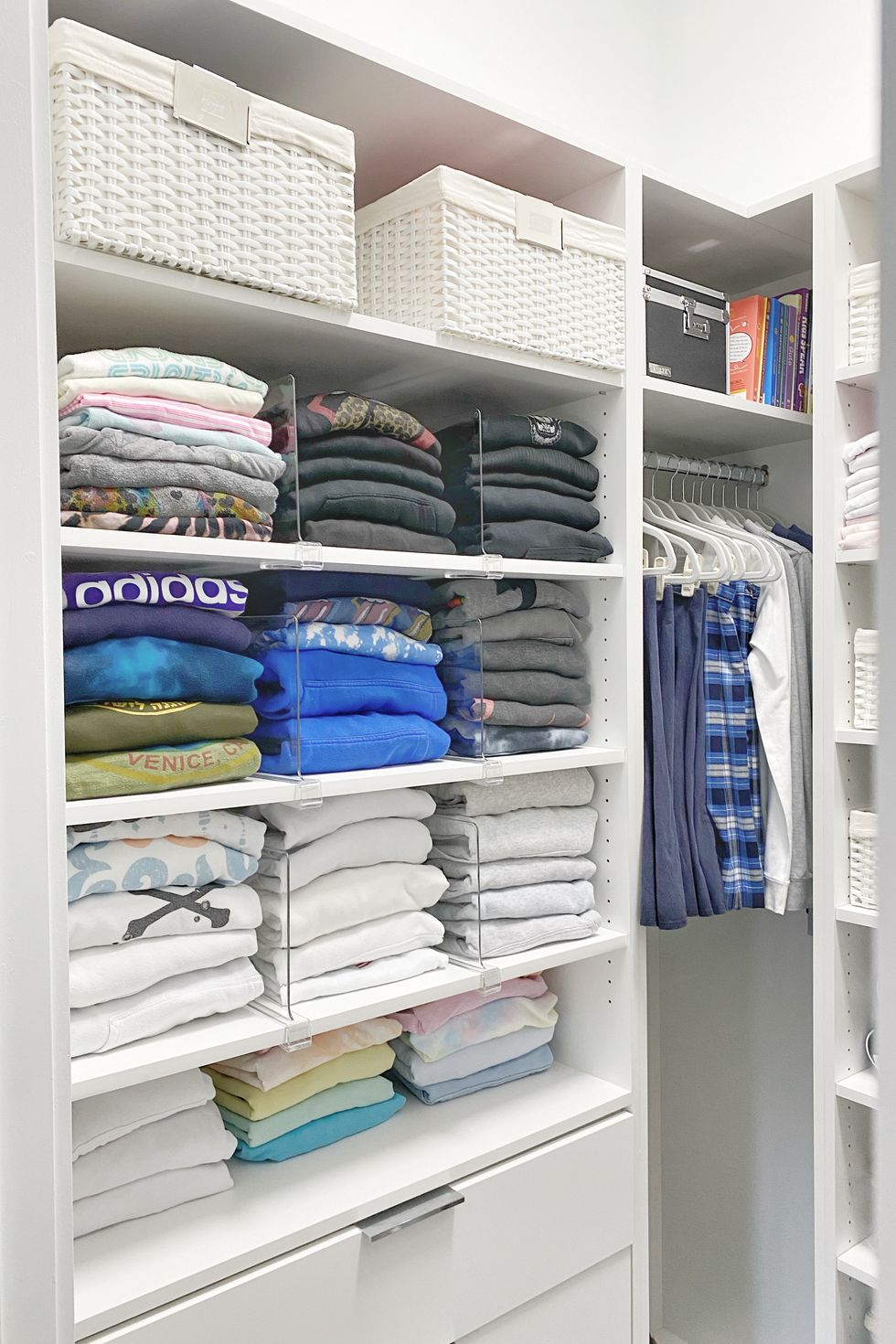 a closet full of folded clothes