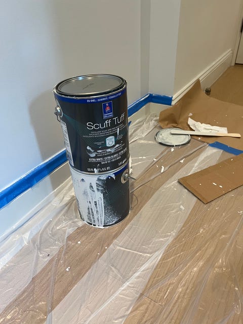 a can of paint in a hallway