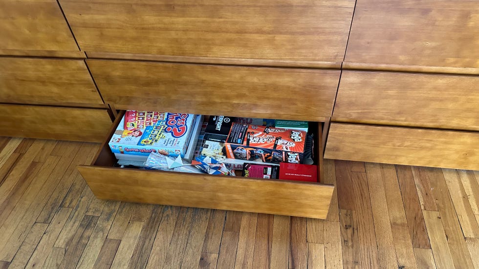 an open thuma dresser drawer filled with board games