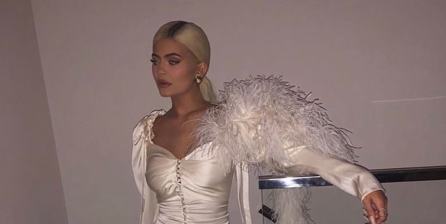 Kylie Jenner Shows Off Holiday Party Style in Leggy Feathered