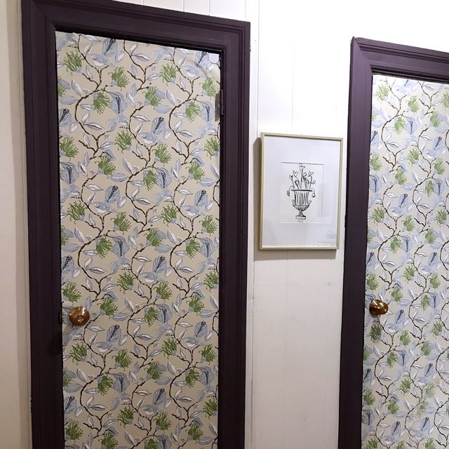 two closet door with floral wallpaper