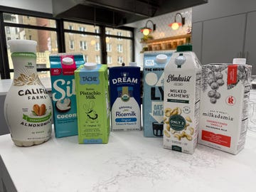 variety of plantbased milk alternatives displayed on a kitchen countertop