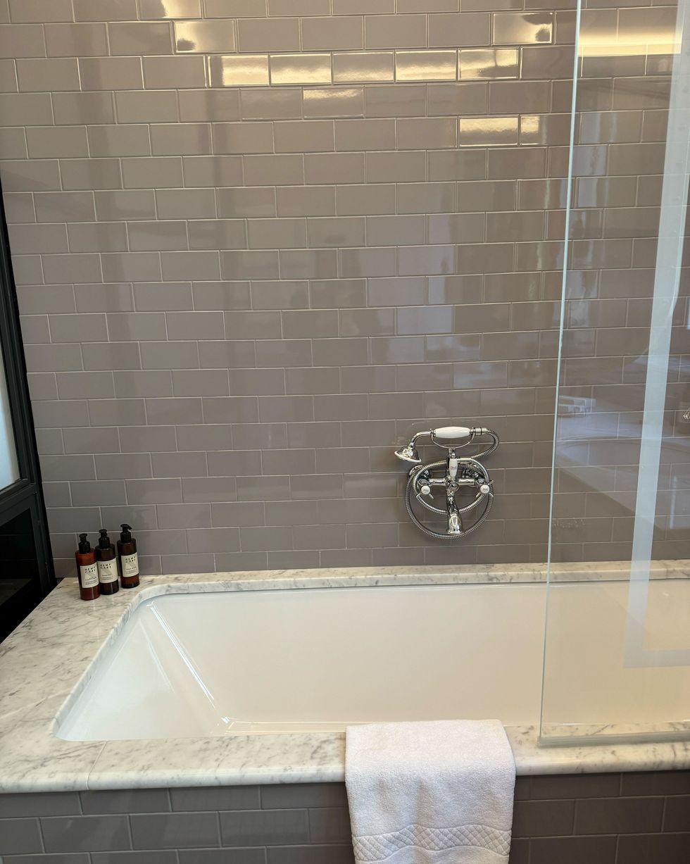 a bathtub with a shower unit
