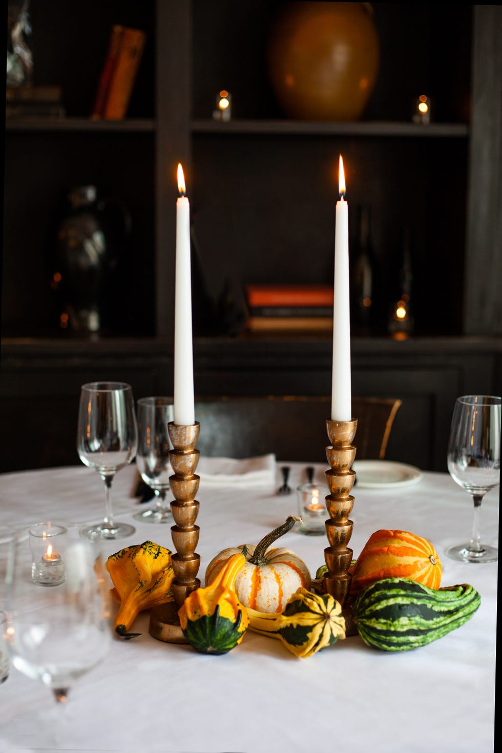 a table with candles and glasses