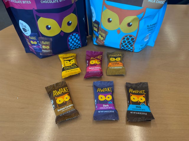 assorted flavors of awake caffeinated chocolate in various colors of packaging