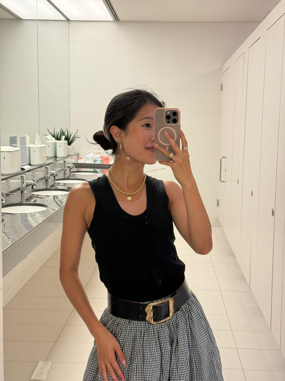 person wearing a black tank top
