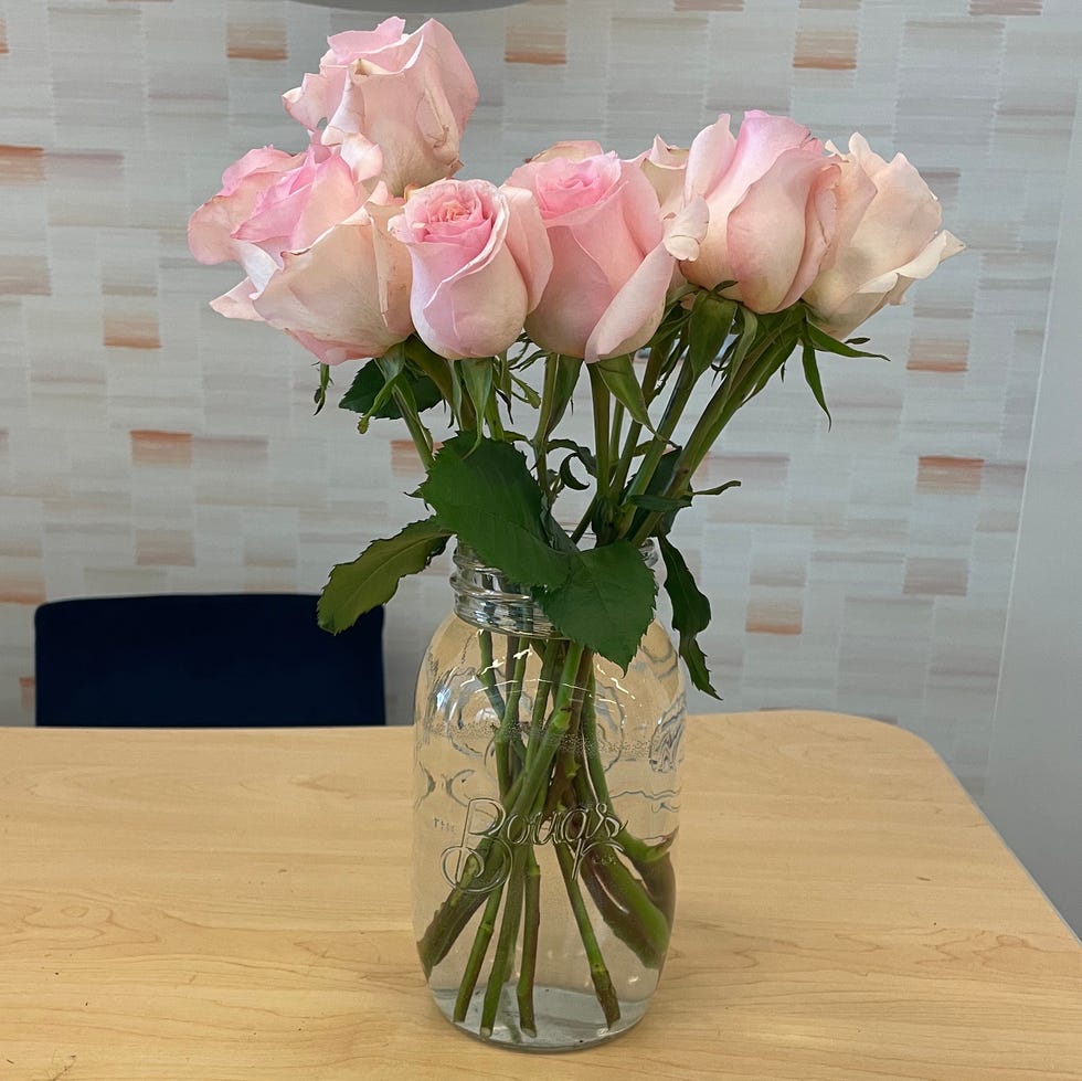 a bouquet of flowers from bouqs roses in a glass vase