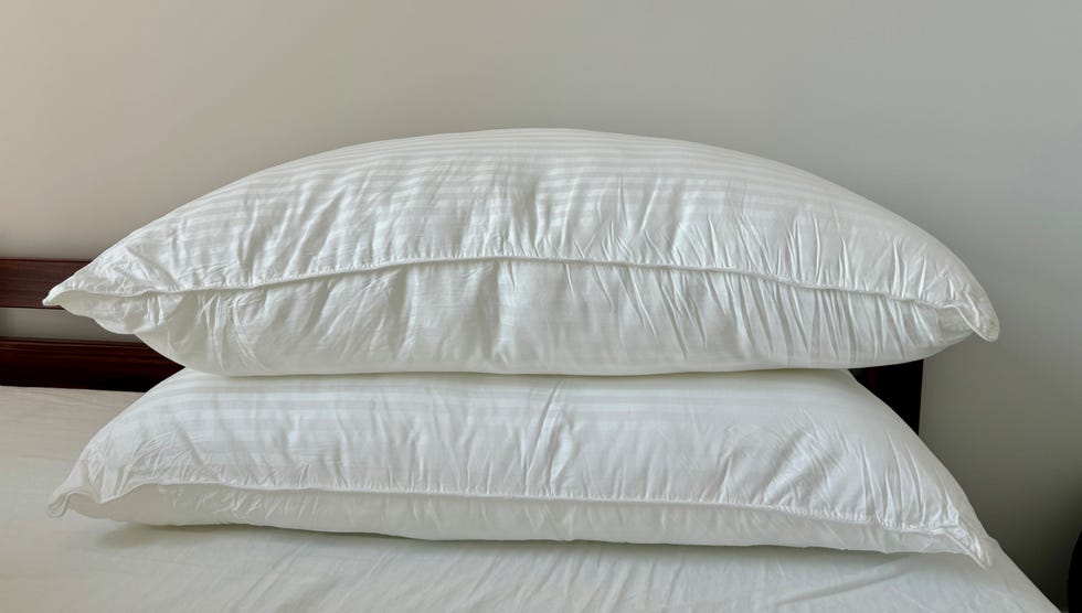 a white pillow on a bed