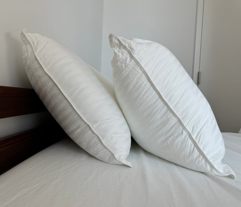 a white pillow on a bed